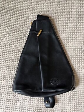 Black leather Longchamp Roseau sling bag with gold-tone hardware